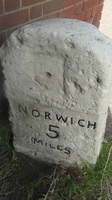 Milestone by wall of old chapel